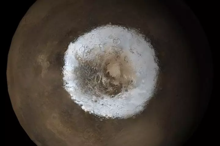 The south pole of Mars, where it's been suggested that there's a subglacial lake of liquid water