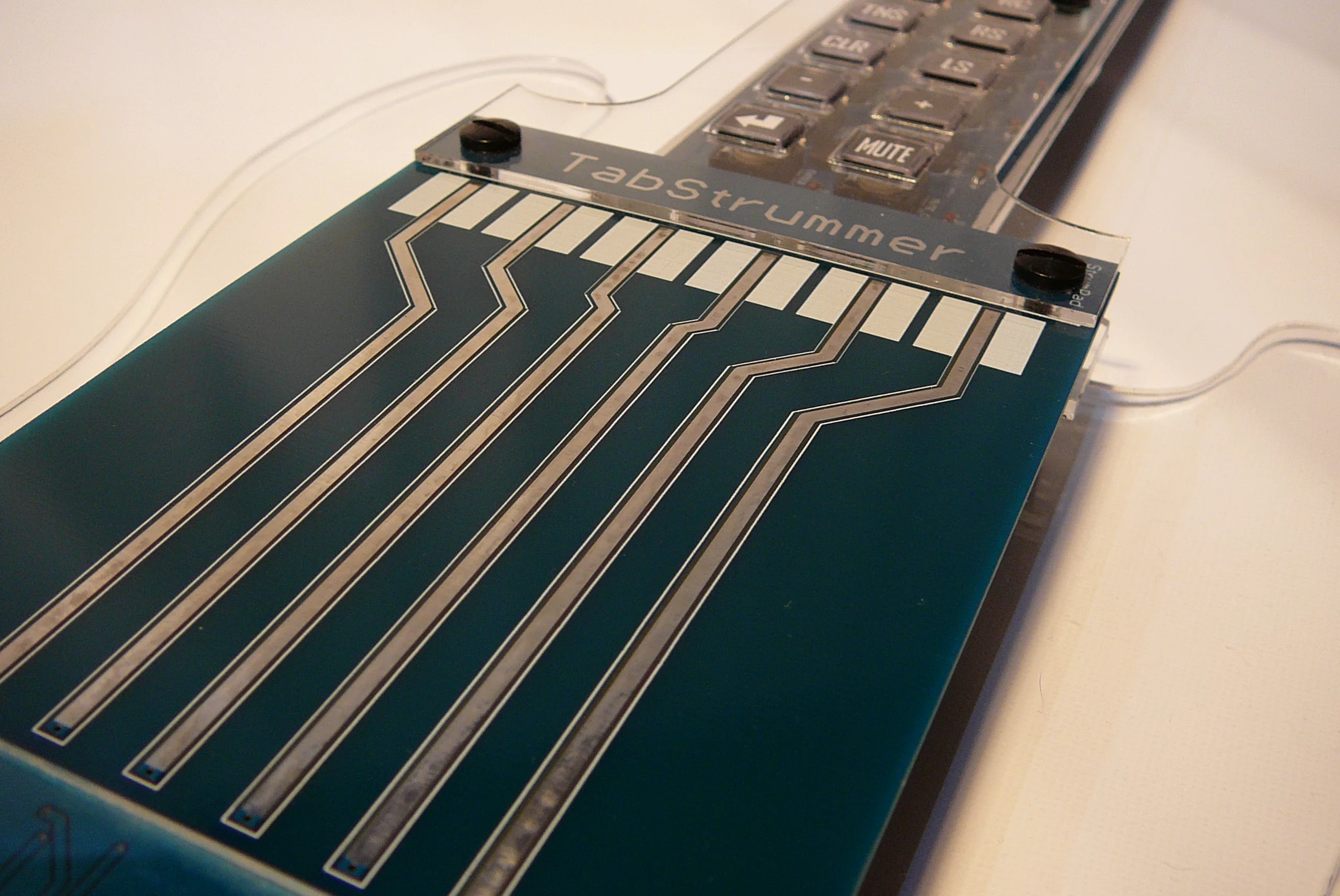 Close up of the Tabstrummer's touch-sensitive PCB trace strings
