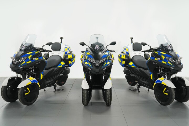 Police officers and emergency first responders could soon be riding all-electris versions of the WMC300FR hybrid tilting three-wheel scooter, which will feature a "big hole" running through the middle to reduce drag and improve per-charge range