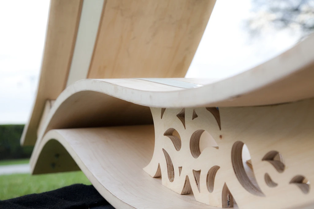 The ornate carvings were made using a laser cutter or 3-axis CNC router