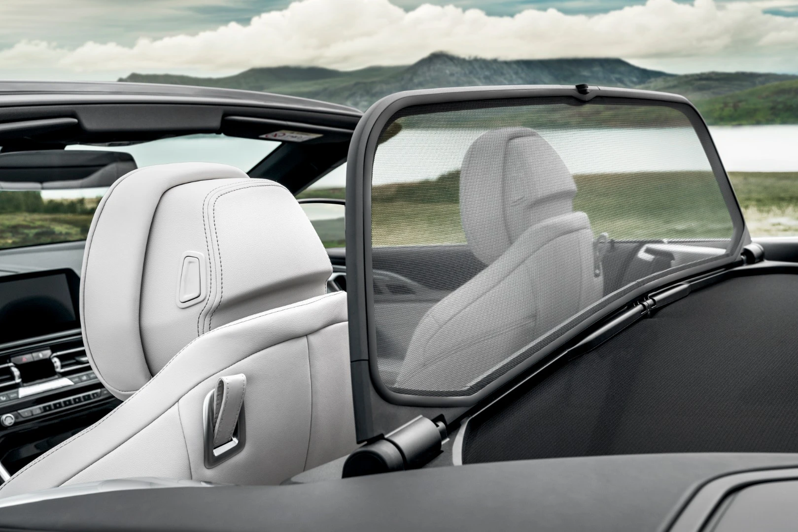 The standard wind deflector boosts comfort during quick, open-top driving