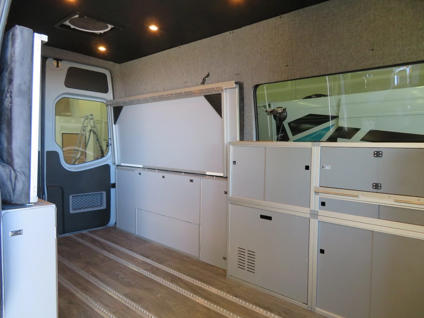 The Sprinter interior keeps things clear for transport and then folds and slides out at camp to create a cozy home away from home
