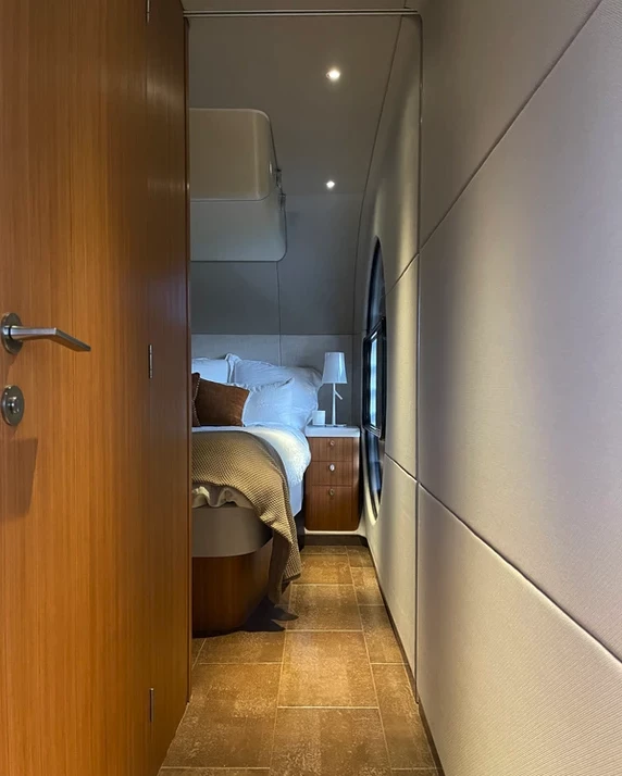 Bathroom door on the left, bedroom at the rear