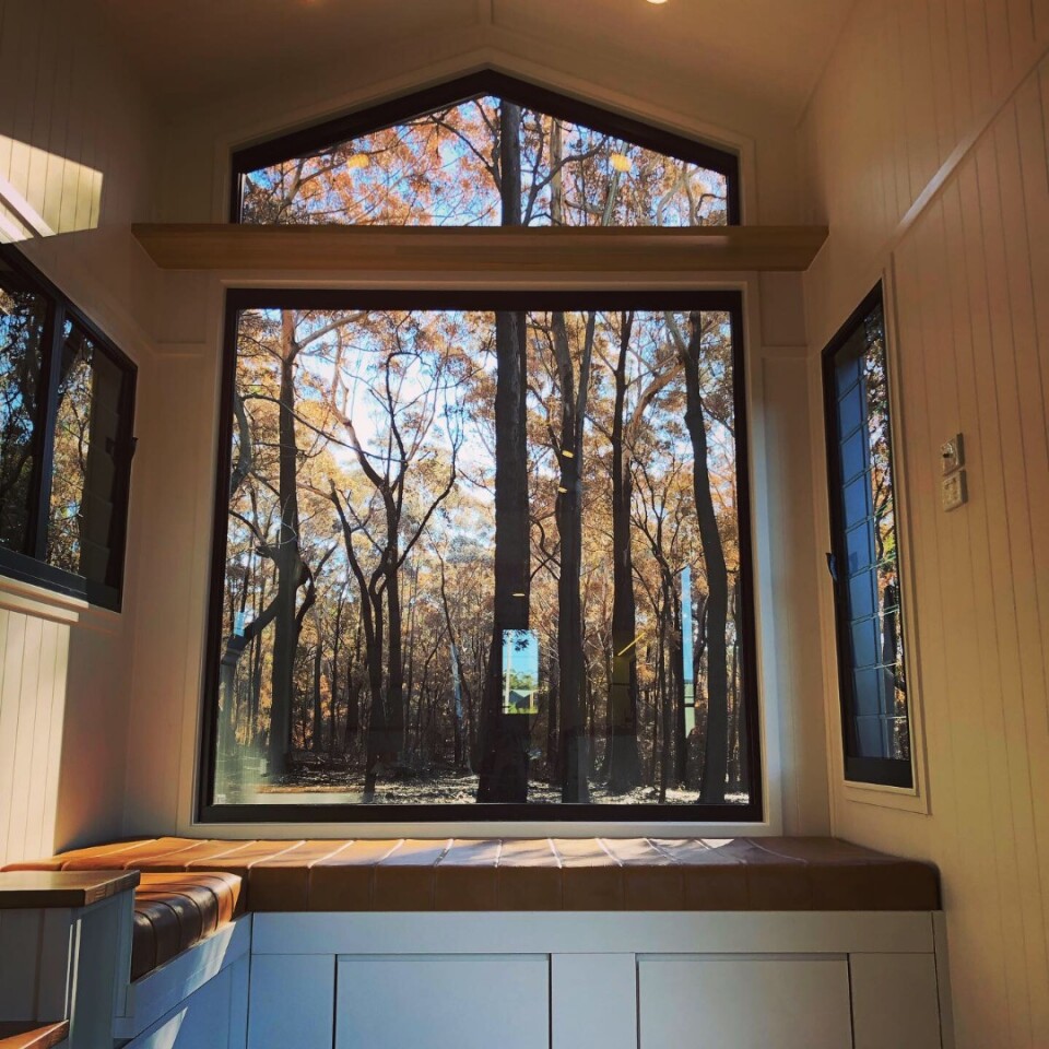 The window wall is made up of a large square window with a smaller triangle on top