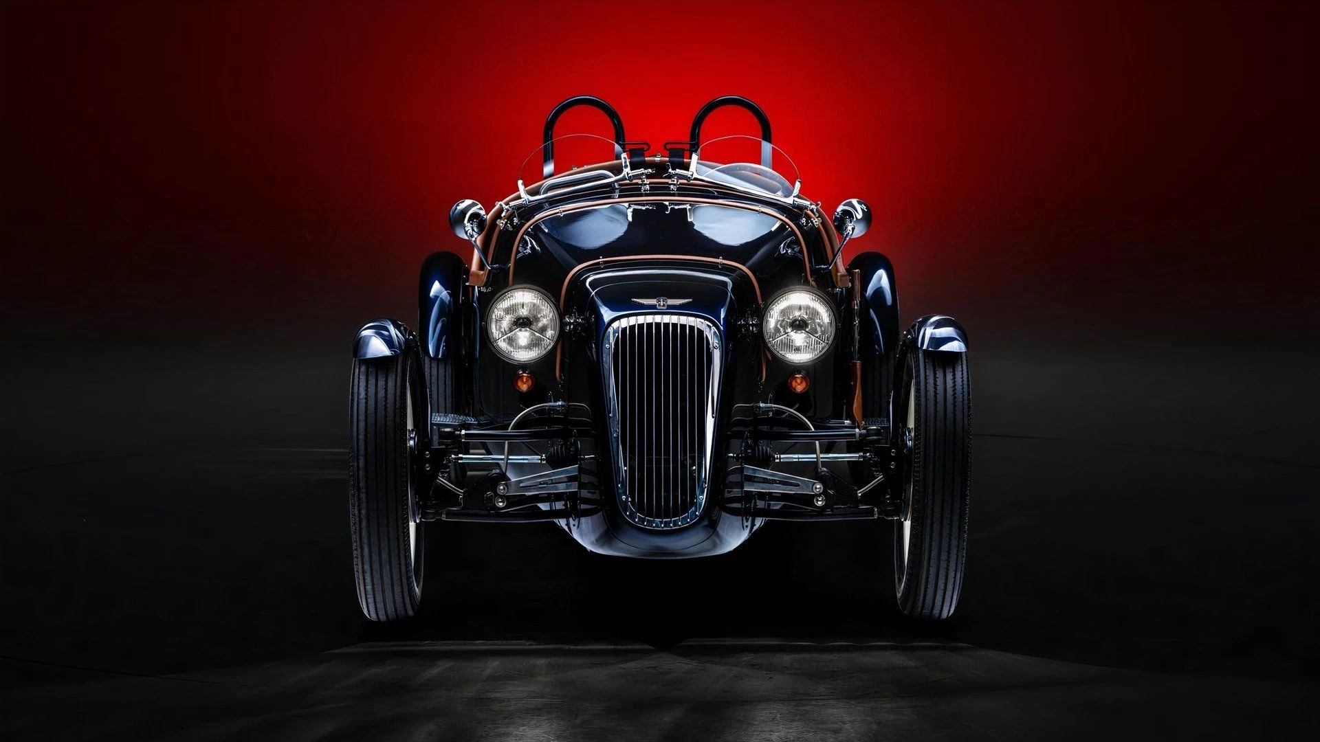 The Arrow Roadster EV is a two-seater that sports cycle fenders, leather bonnet straps, and boat tail coachwork