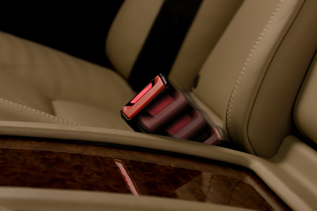 Mercedes' active seat-belt buckle extends from the upholstery when the rear door is opened