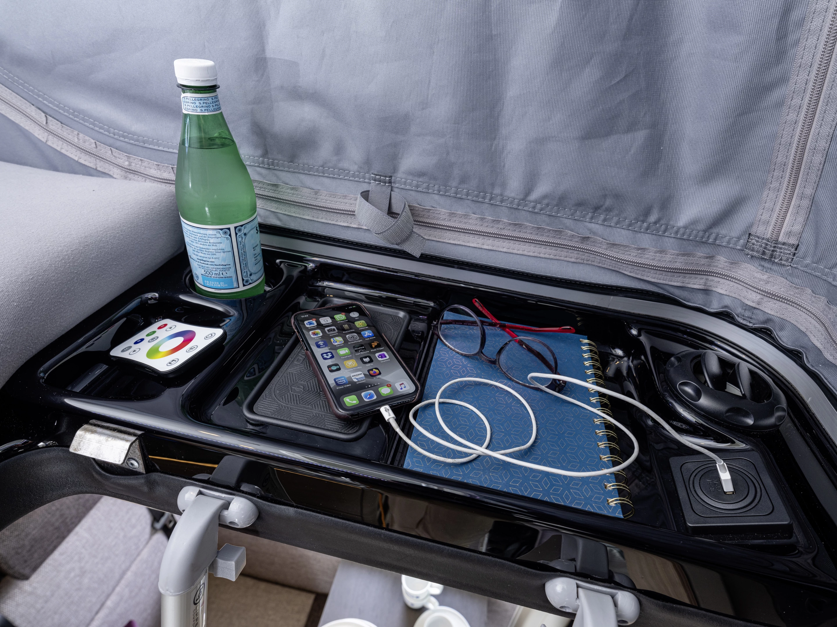 Each of the two campers has his or her own dedicated storage tray complete with USB charging and available induction charging pad