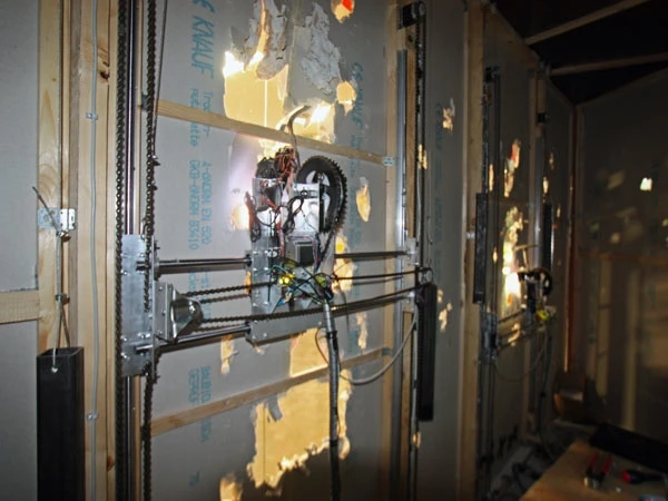 The robots share the wall space and the mechanism for moving around