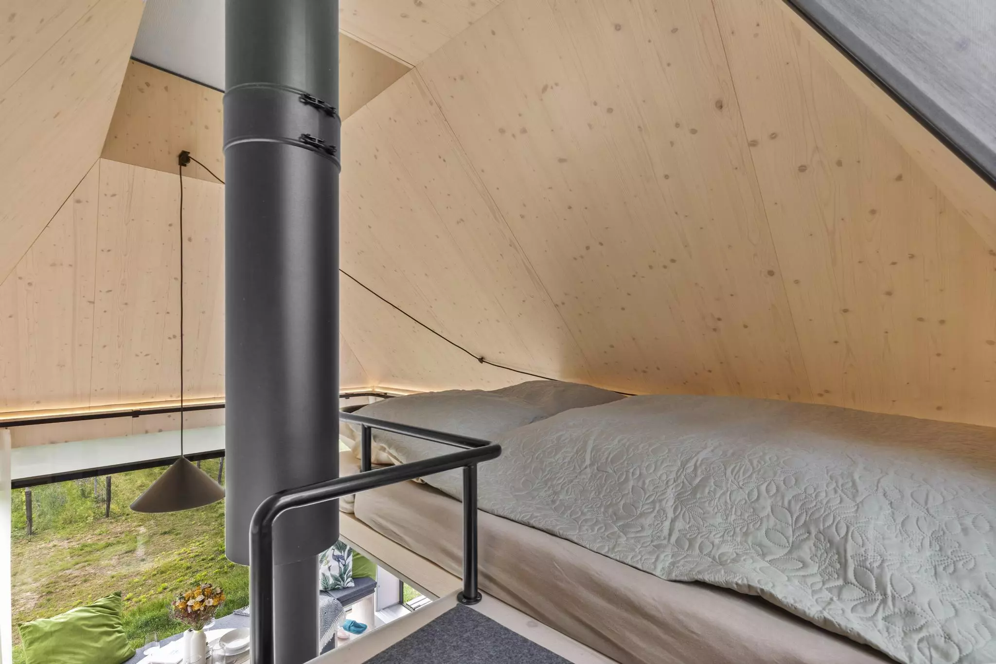 Cabin Devín's bedroom is reached by a removable wooden ladder