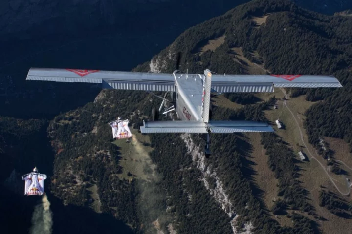 Fred Fugen and Vince Reffet prepare to enter the airplane, flown by Philippe Bouvier