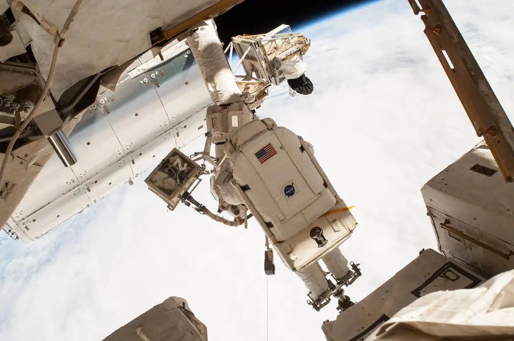 NASA astronaut Terry Virts outside the International Space Station as part of a mission to reconfigure it for docking by US commercial crew vehicles