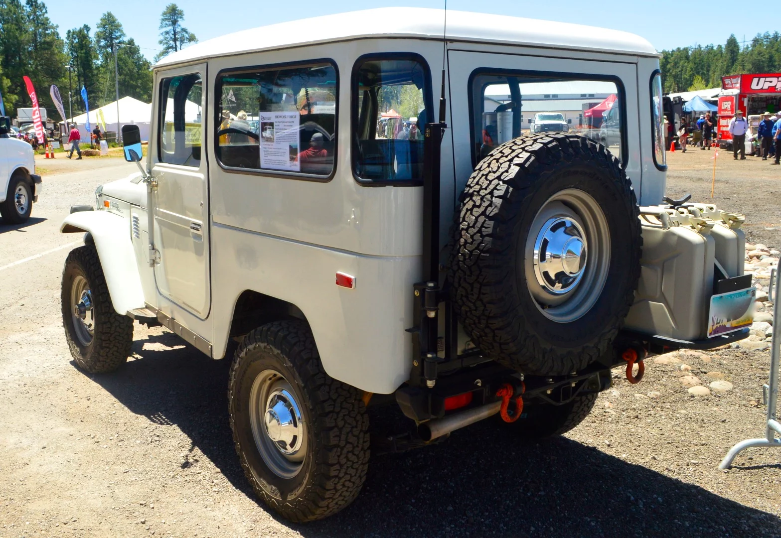 As described on its showcase sticker, this 1973 FJ40 has 315,000 miles of global overlanding experience