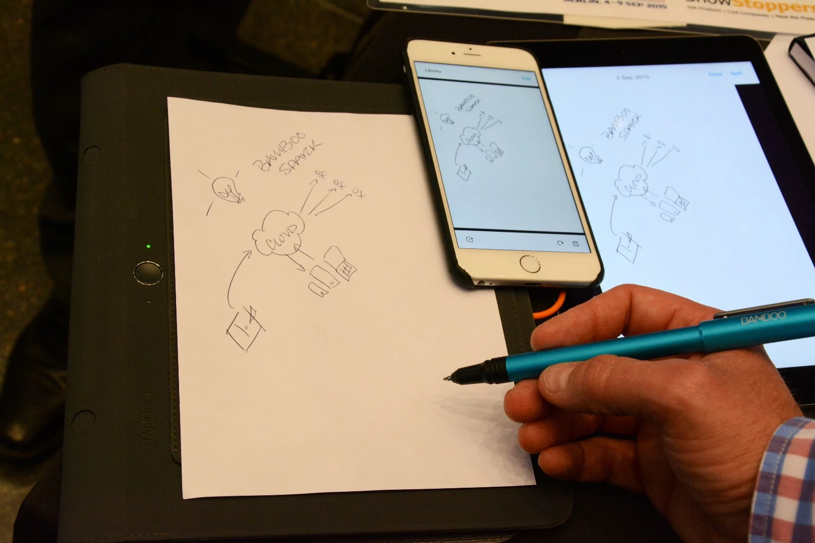 Pressing a button to the left of the folio wirelessly transfers the notes or doodles on the paper to a companion app