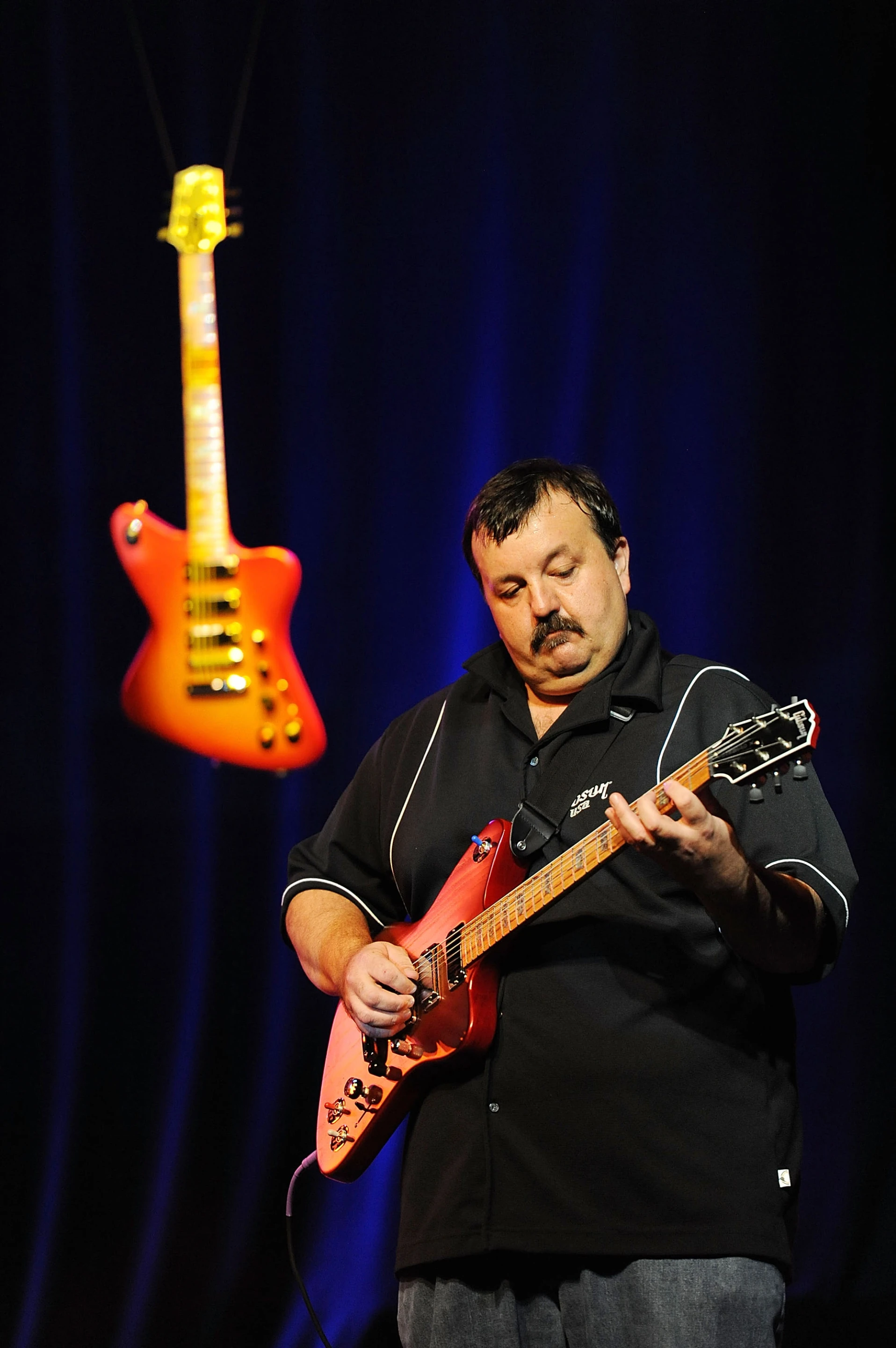 Gibson's Frank Johns demonstrates the Firebird X at the press launch in New York