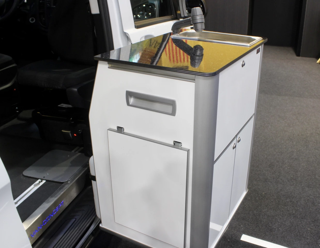The kitchen features a swiveling design for indoor/outdoor use