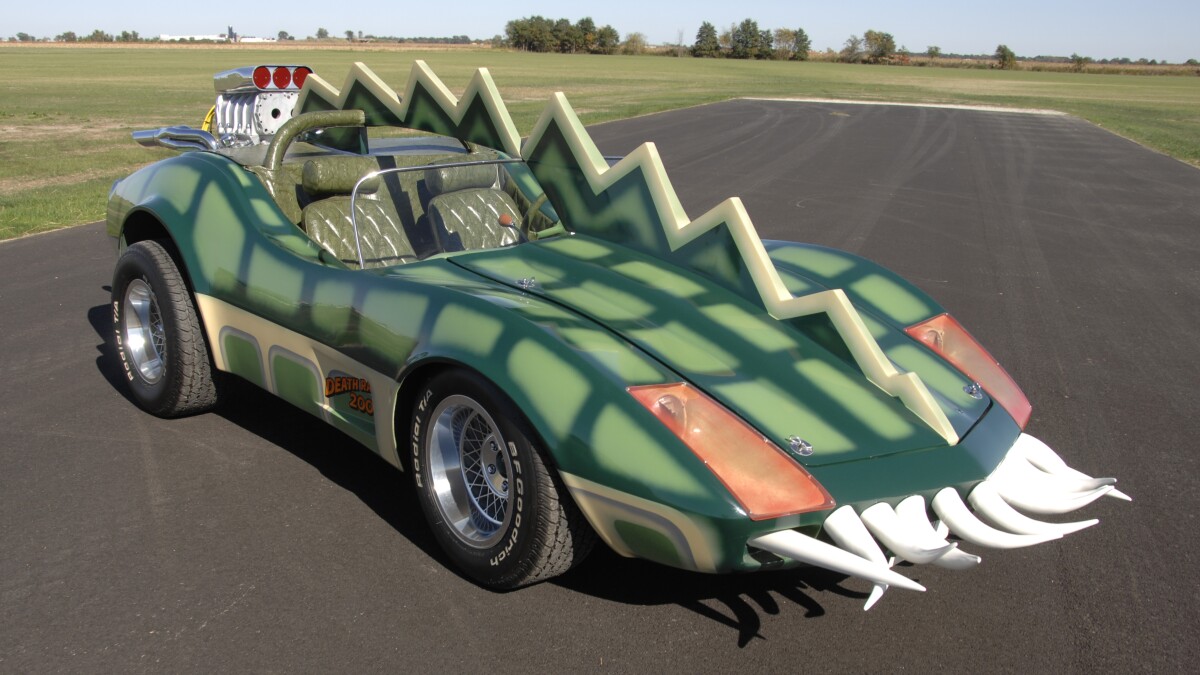The car that is coming to auction is the Alligator Corvette driven by Carradine in Death Race 2000 (1975). The one-of-a-kind “alligator” Corvette (it's actually a Volkswagen chassis with an air-cooled Corvair motor), is expected to fetch between $20,000 and $25,000, despite the fact it got lots of screen time as Carradine (Frankenstein) fights against his deadly rival Stallone (Machine Gun Joe).
