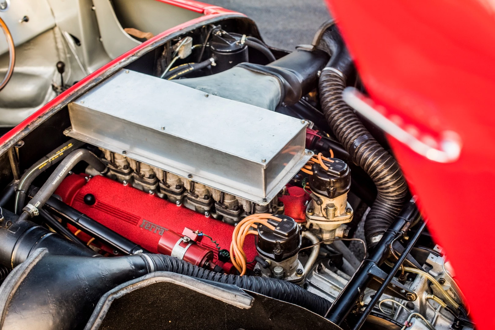 The Ferrari 275P runs a 3.3 liter V12 that produced 316hp at 7700rpm