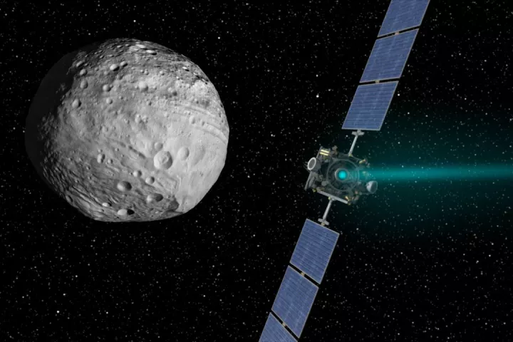 Artist's concept of Dawn approaching Vesta under ion drive (Image: NASA)