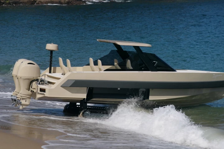 The seven-seat amphibious Iguana Commuter Limousine combines the company's signature retractable caterpillar tracks, with an adjustable retractable hardtop and shock-mitigating seats
