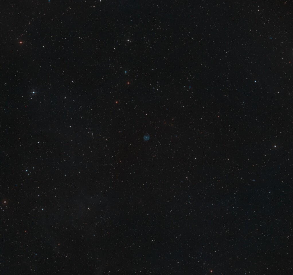 A composite view made from exposures collected for the Digitized Sky Survey 2 showing the region surrounding ESO 577-24, which can be found in the center of the image