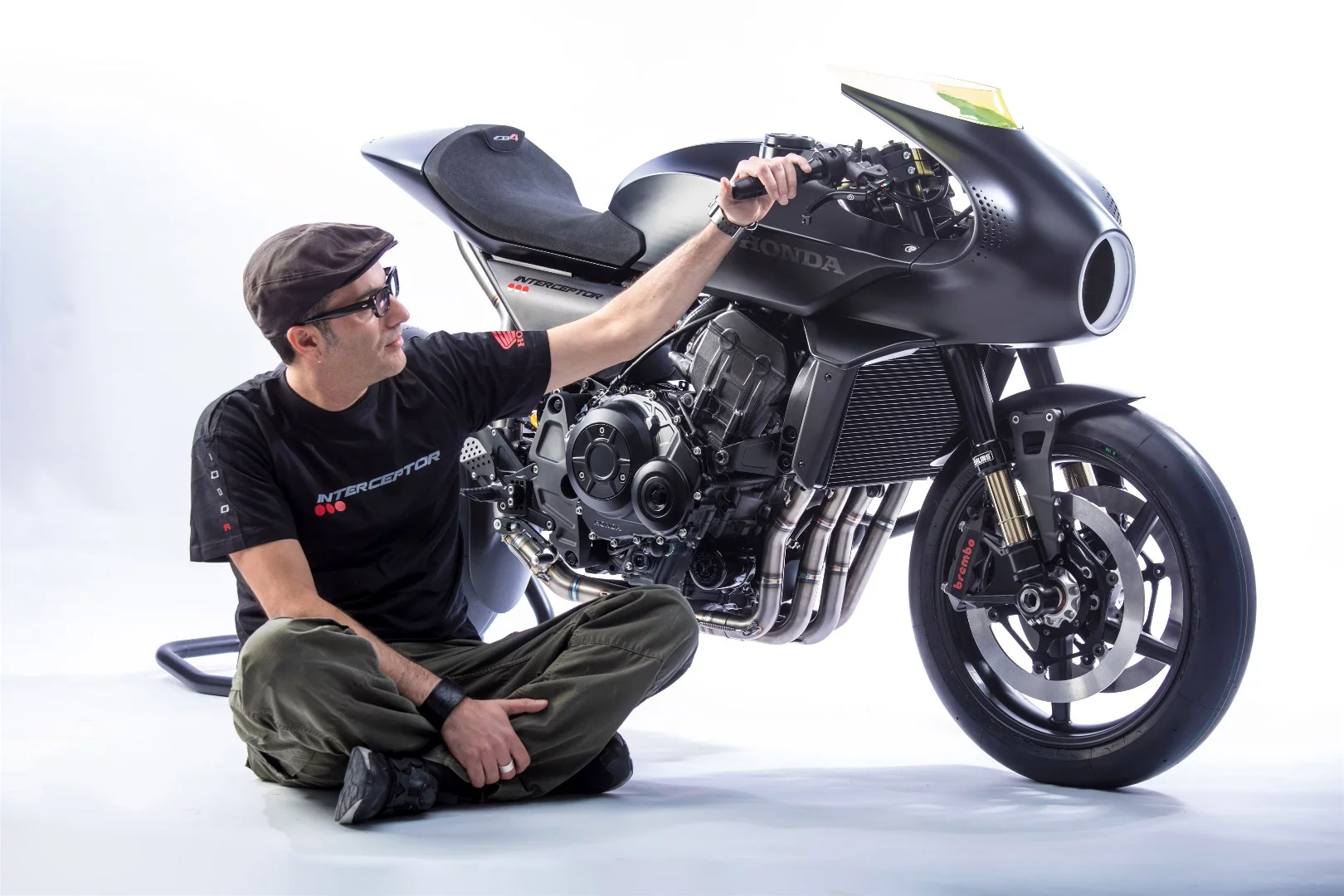 Honda's CB4 Interceptor concept: with designer Valerio Aiello, seated and stroking the handlebar