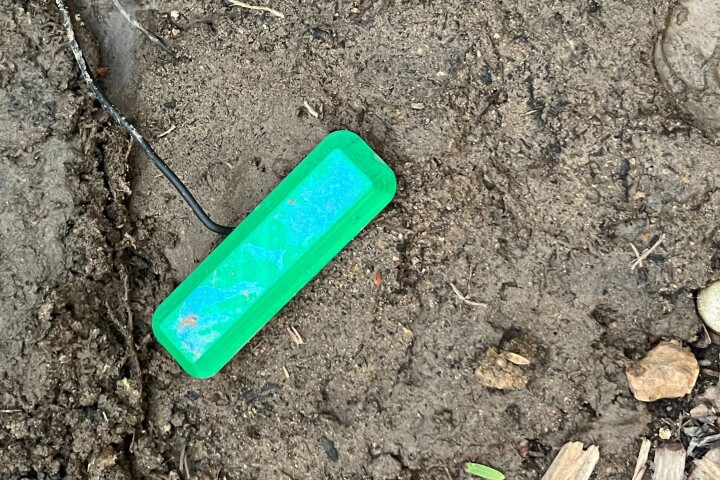 A microbial fuel cell buried in soil and generating power