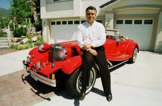 Alfred J. DiMora with the Clenet Series IV Sportster that he designed and produced at Clenet Coachworks