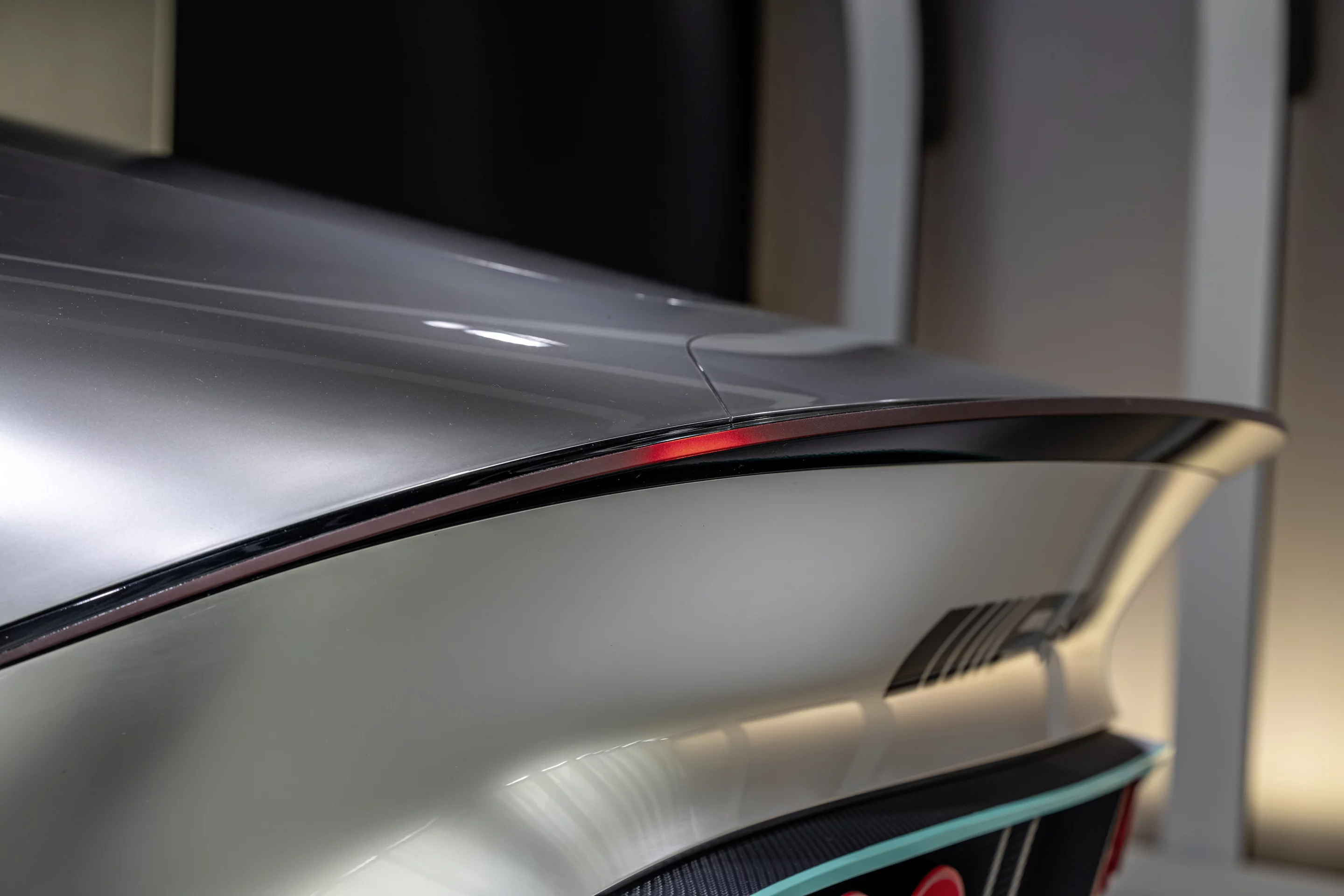 The crisp edge of the spoiler includes an integrated taillight
