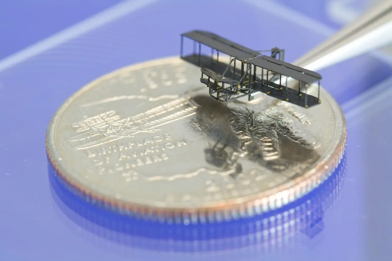 The PC-MEMs manufacturing method, developed at Harvard Microrobotics Lab, was used to create this tiny model of the Wright brothers' bi-plane
