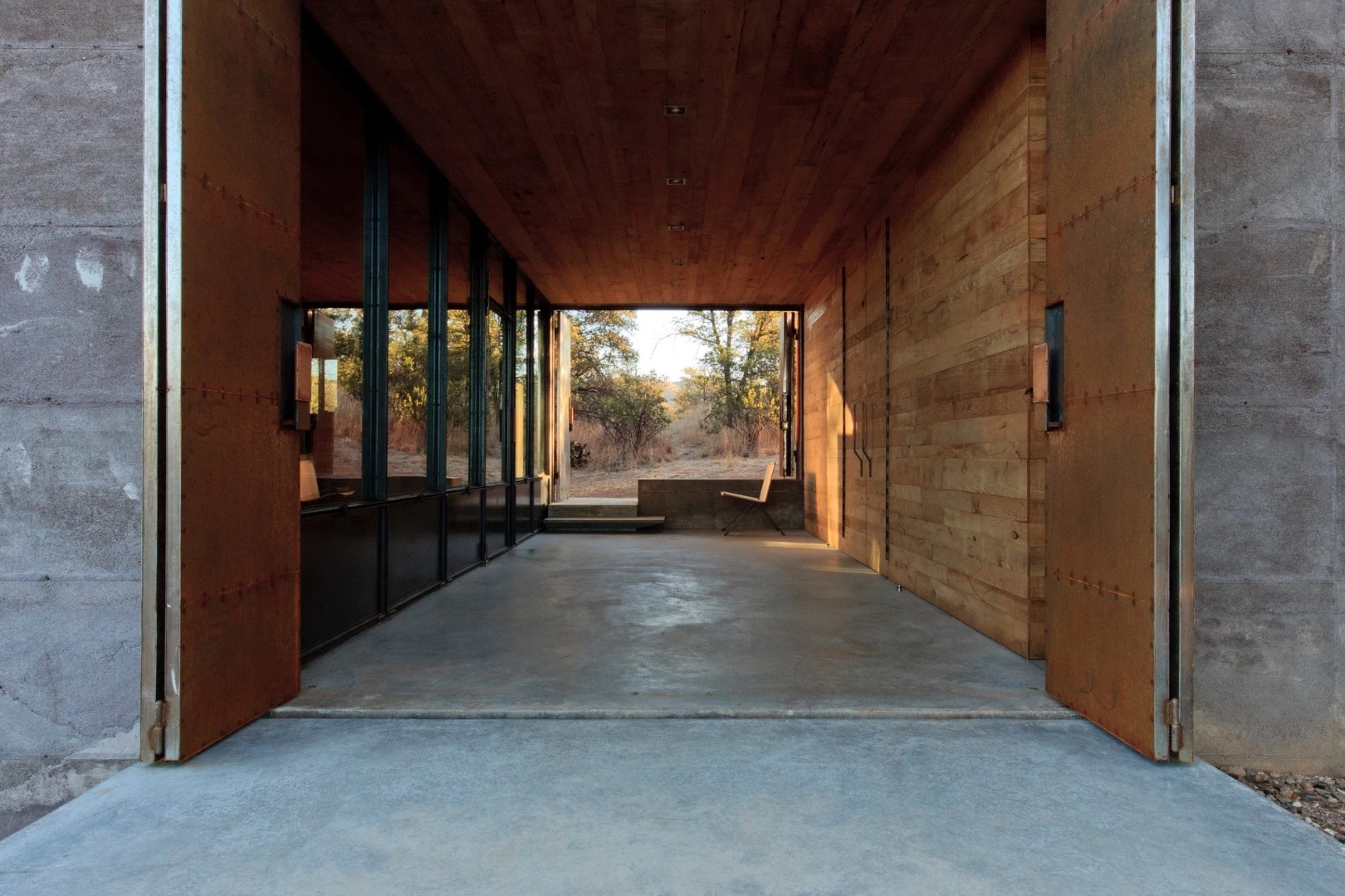 The recently-completed home is definitely a case of function over form and looks like a bunker of some kind at first glance