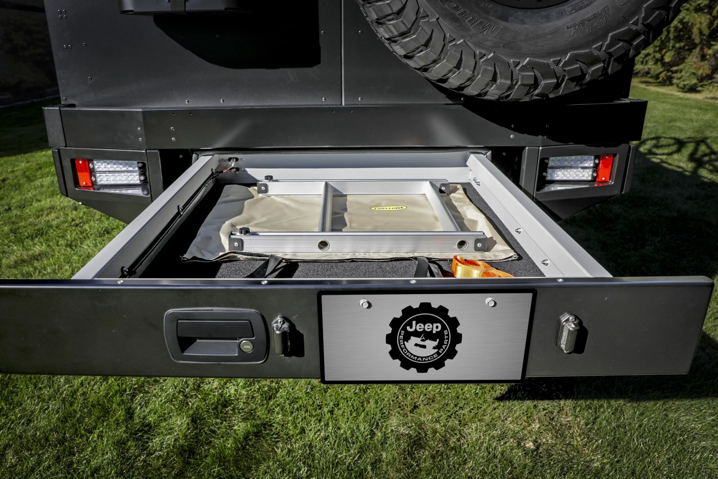 The rear bumper drawer houses a ladder for accessing the bikes on the roof