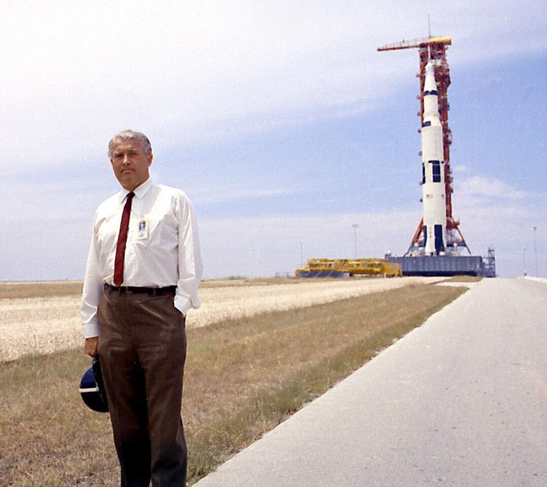 Dr von Braun pauses in front of the Saturn V vehicle being readied for the historic Apollo 11 lunar landing mission at the Kennedy Space Center (KSC)