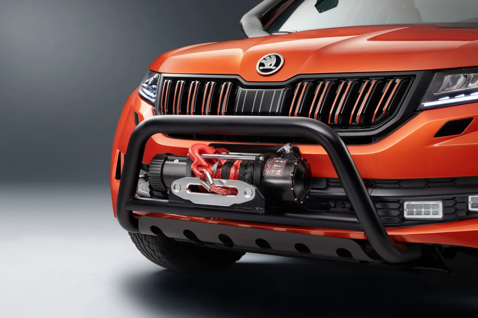 With the truck's winch, bullbar, and large off-road tires, bright paint color offsets the black details