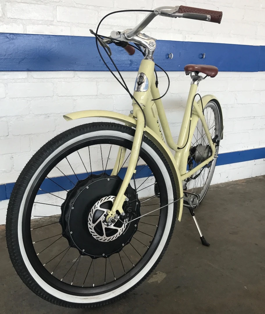 Making use of the EZ Wheelie's 250 W brushless hub motor is as simple as slotting the wheel into the forks of your ride