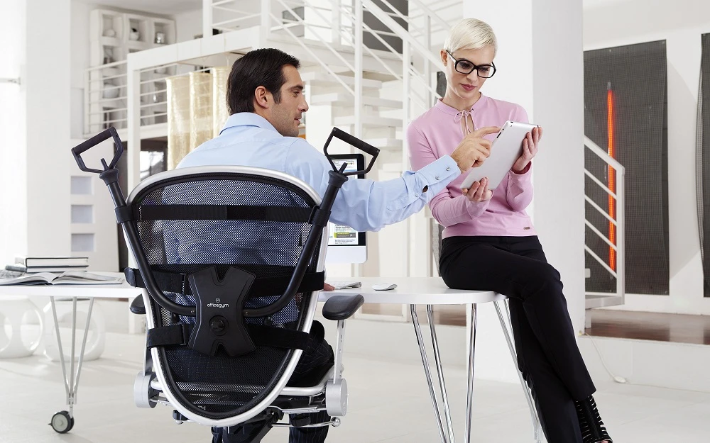 OfficeGym attaches to your chair to be used at any and every opportunity without interfering with your work