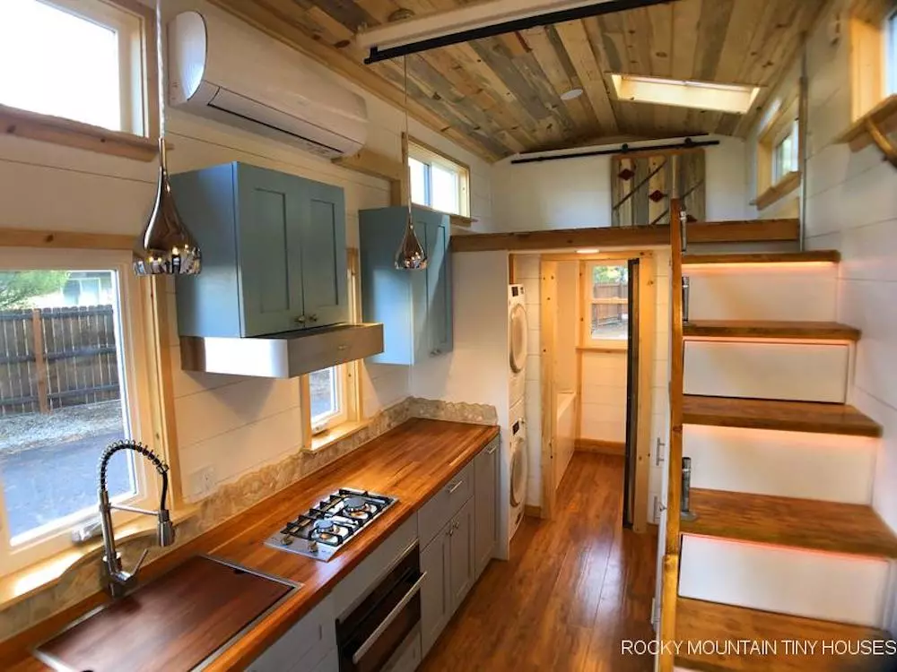 The Bradford 26' Tiny House's loft-style bedroom is reached by storage-integrated staircase