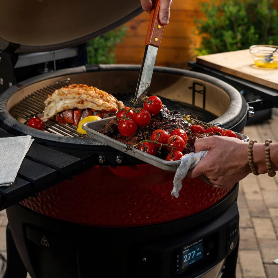 The Big Joe Konnected Joe offers 450 square inches of cooking surface, along with a two-tier cooking setup and folding shelves on either side of the grill
