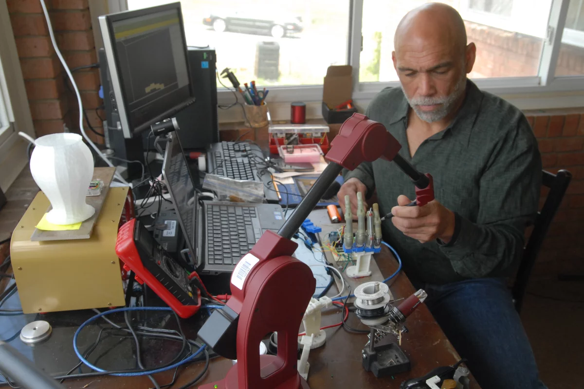 Lyman Connor works on his bionic hand