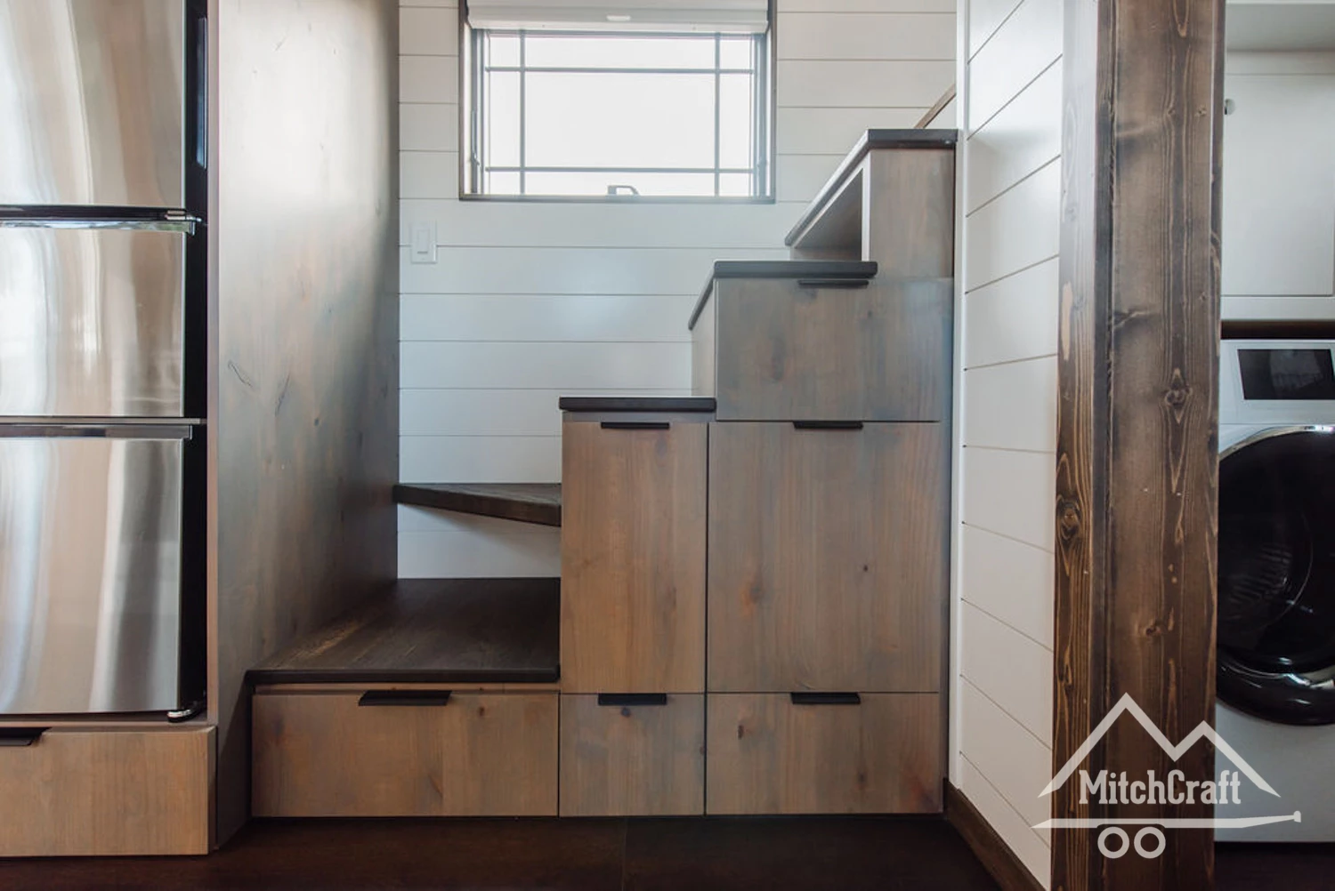 Lisa's 30 x 10 Tiny Home features a storage-integrated staircase