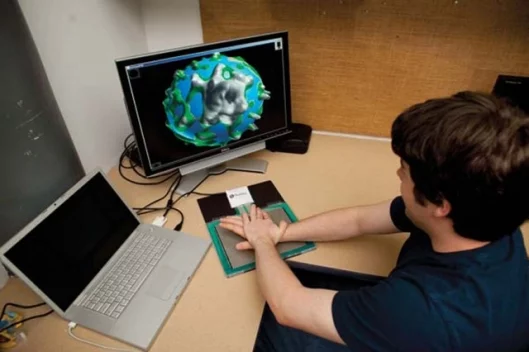 A demo program allows users to manipulate a globe and alter its surface by pressing down on the pad