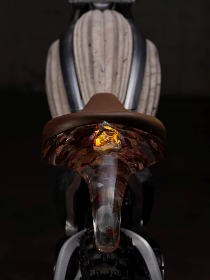 The traditional LED headlight and taillight have been switched out for hand-blown glass sculptures