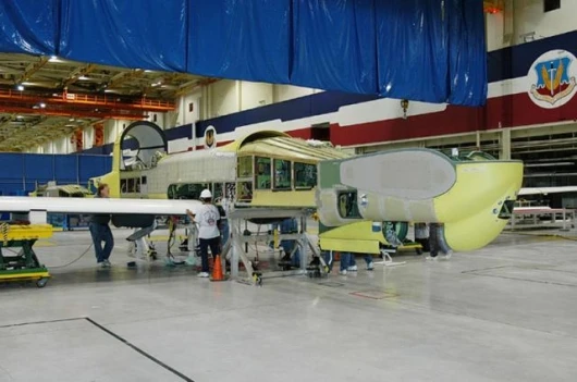 The enhanced graphite-composite wing is shown attached to the fuselage of an RQ-4B