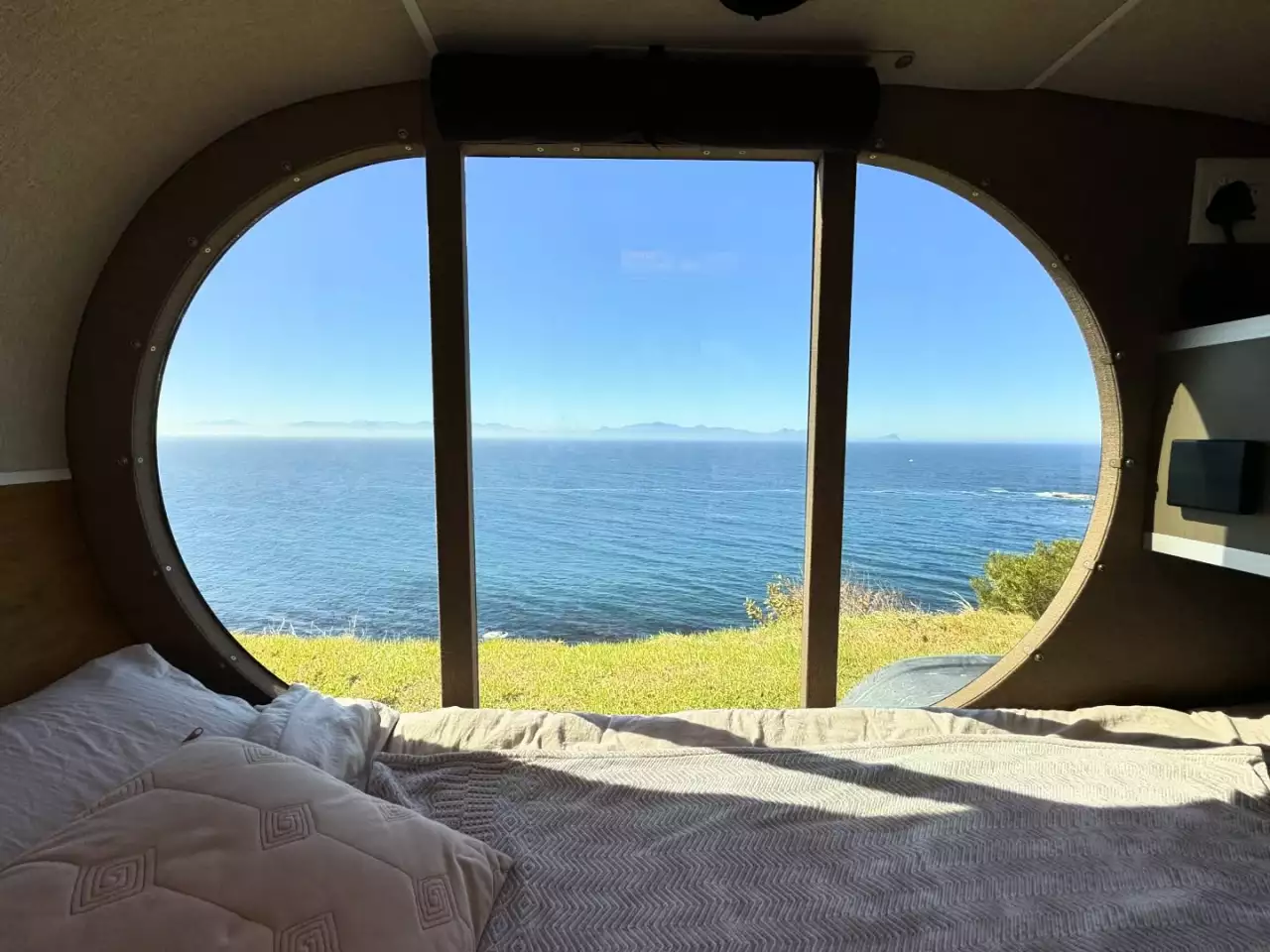 A wake-up call with a serious view thanks to Naledi's oversized glass door/window setup