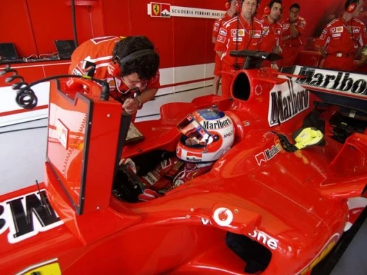 Rubens's Ferrari looks like it wears a TV monitor permanently - it doesn't, but the snug fit is just another example of the ten tenths approach of the Ferrari team.