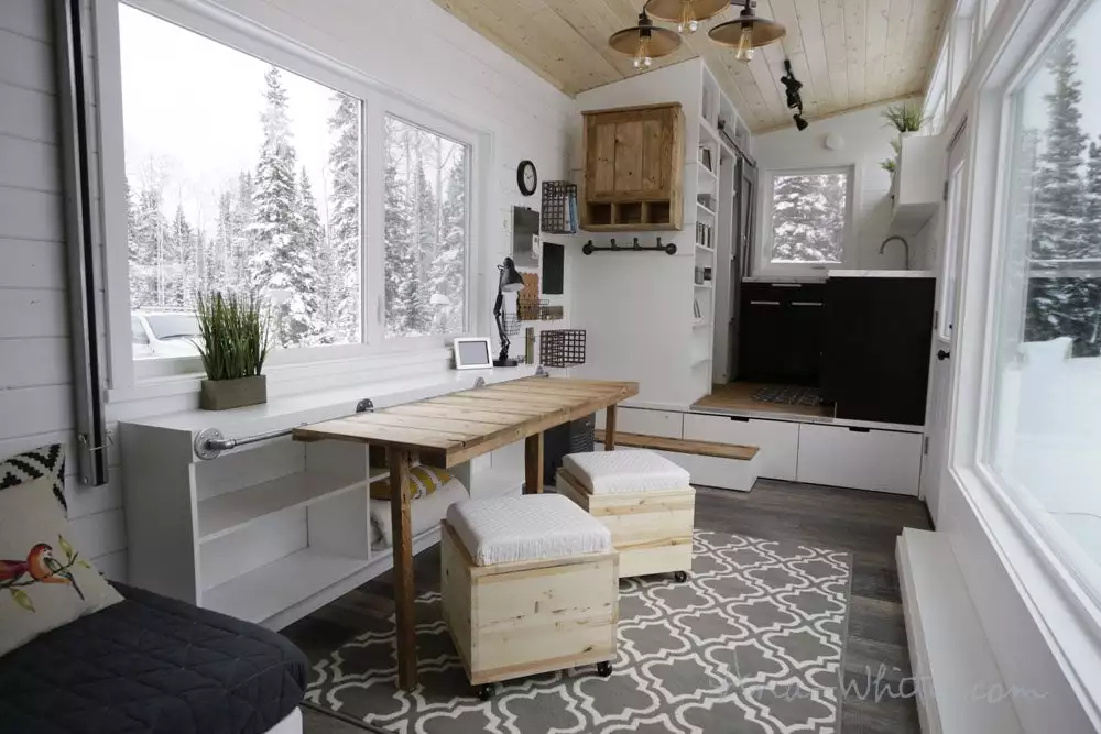The Open Concept Rustic Modern Tiny House's storage unit, configured as one large desk