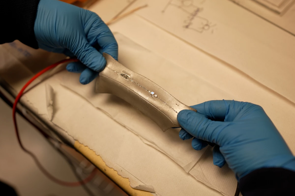 Electrical circuits within the material still work after being stretched or having holes punched in them