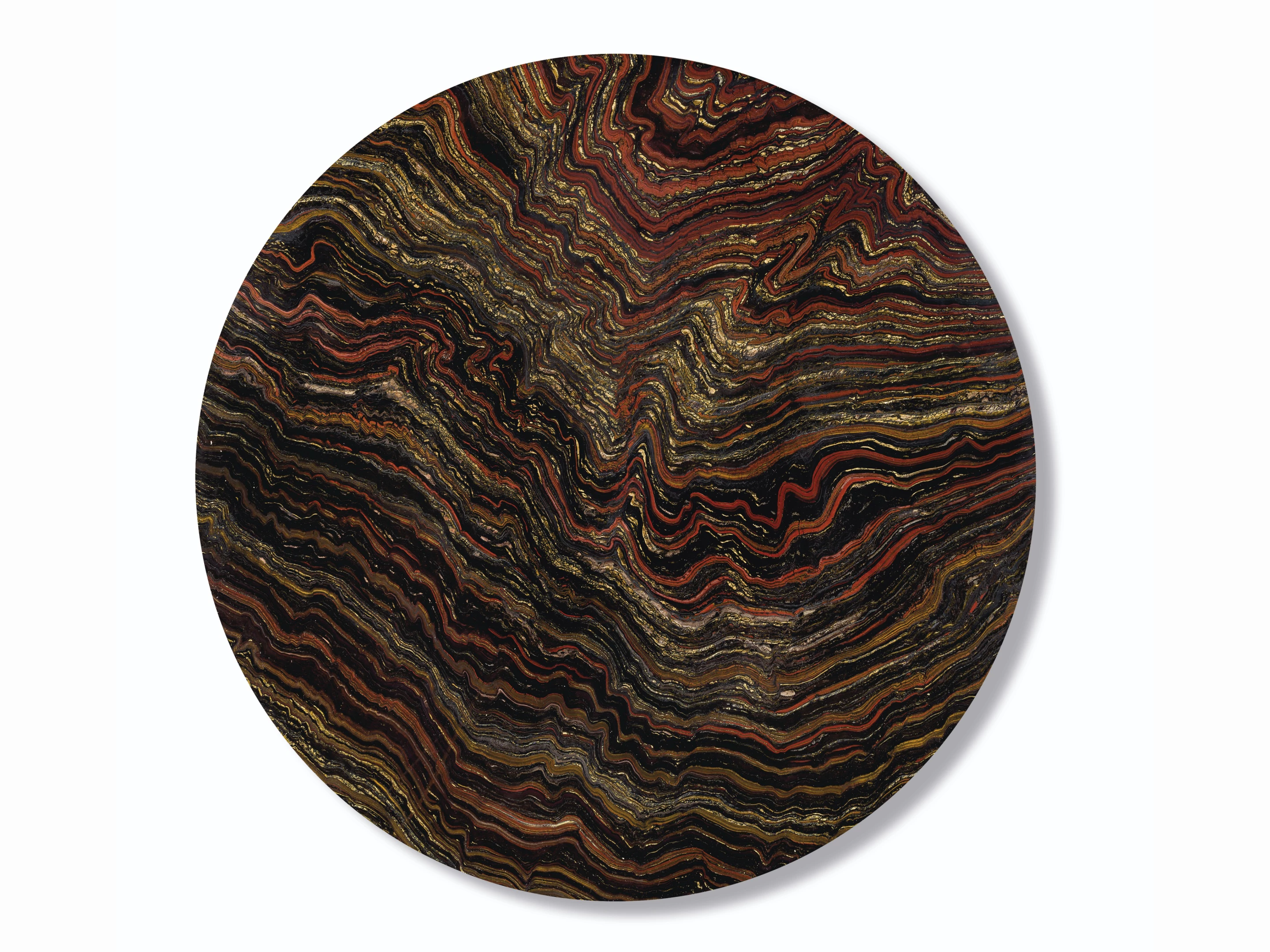 33-inch diameter "table top" 2.5cm thick specimen of banded layers of hematite, jasper and chatoyant Tiger-eye from the Paleoproterozoic (2.5 to 1.6 billion years ago) | Sold for: $12,997 (£10,000) by Christie's on October 28, 2020