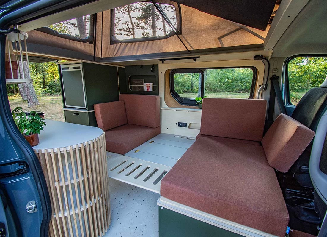Drop down the table, add in a couple of platform panels and fill in all the cushions to make the lounge a bed