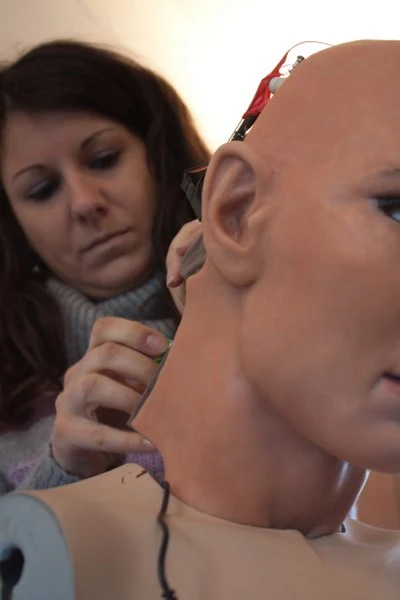 Thirty-two servo motors are integrated in the android skull and neck