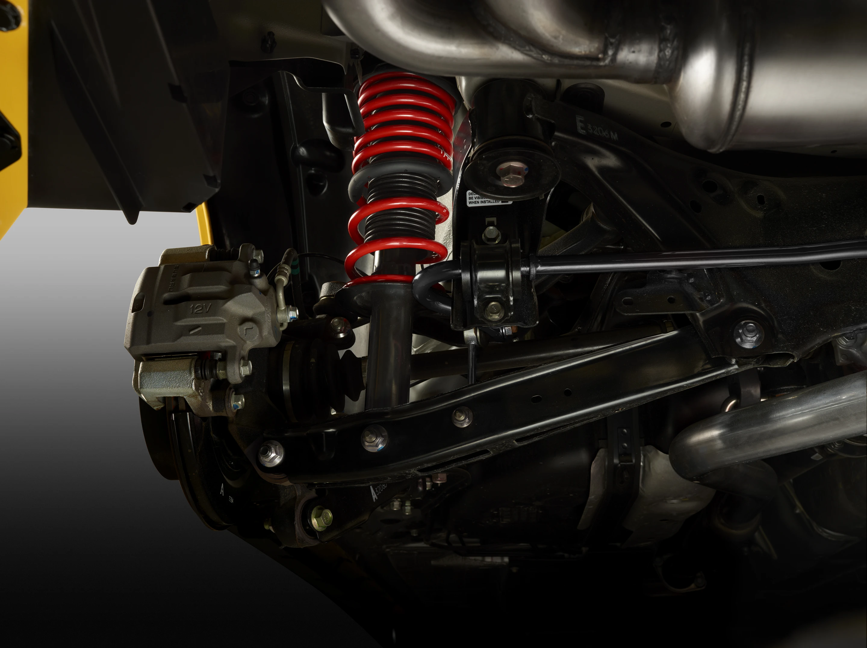 The FR-S suspension is upgraded with TRD lowering springs